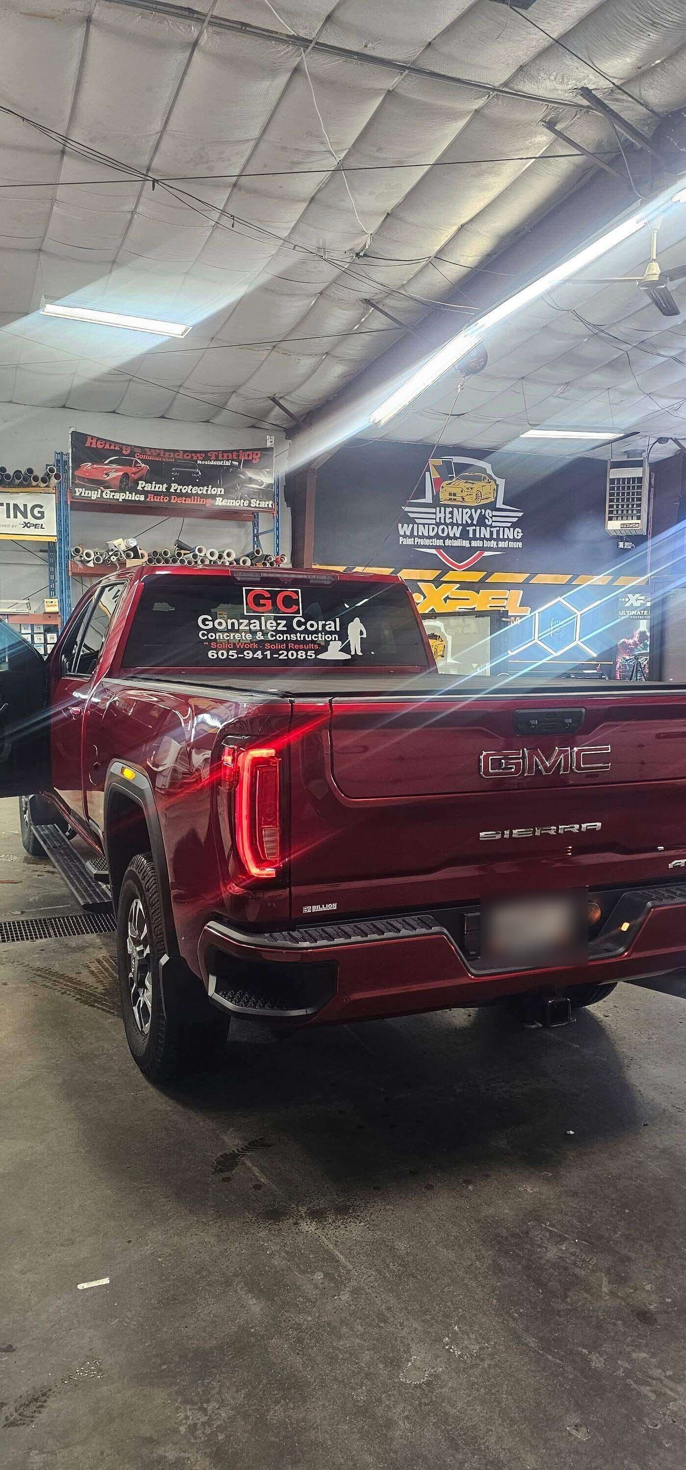 Our GC Concrete & Construction crew truck, lettered with the GC mark, parked on a finished shop floor